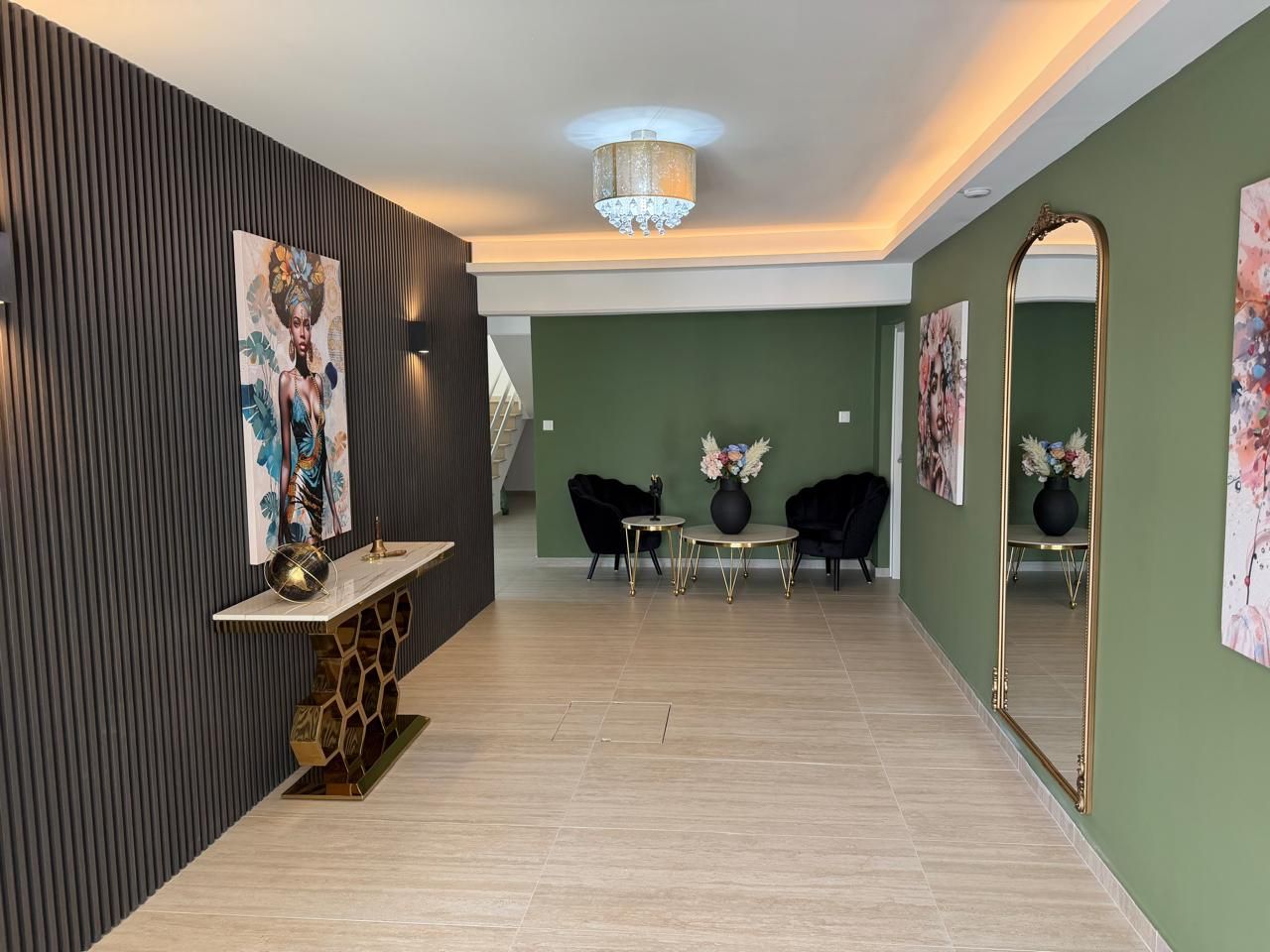Completed apartment building entrance with decorative panelling and contemporary finishes