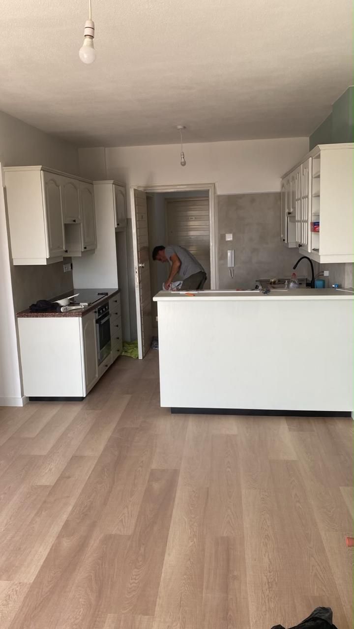 Renovated apartment kitchen with new flooring