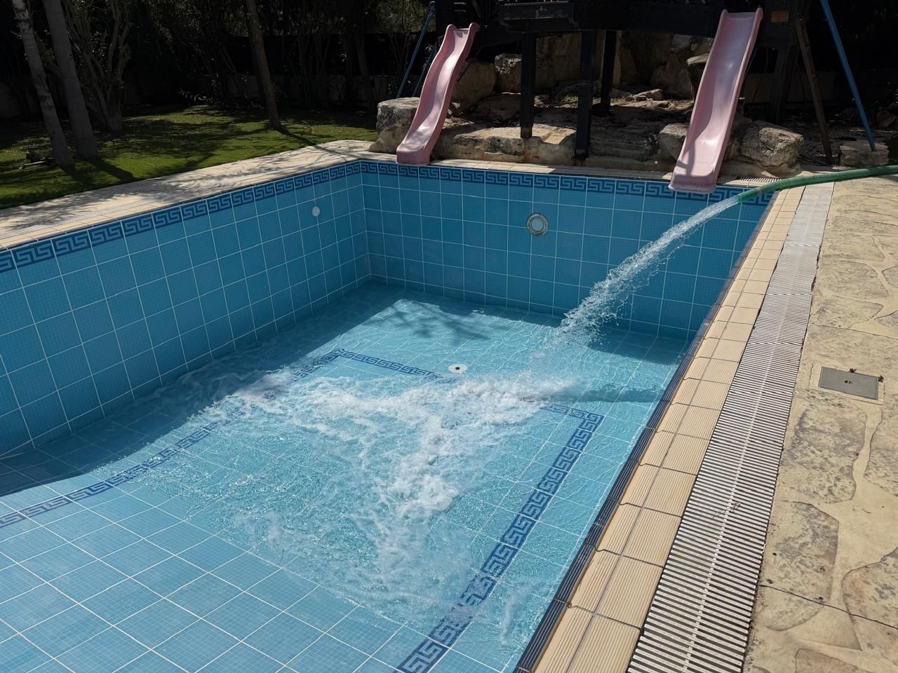 Swimming pool being refilled after refurbishment