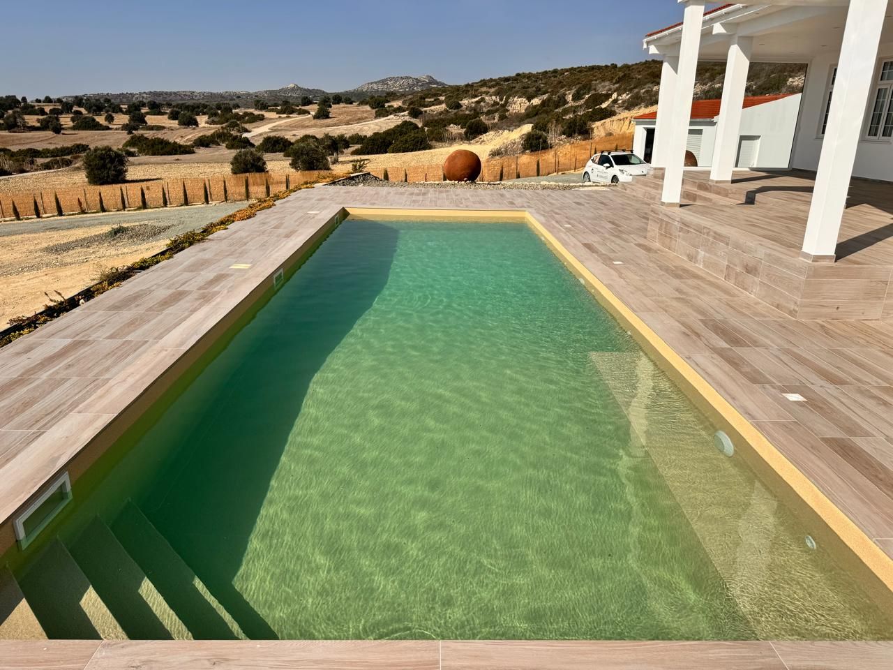 Finished swimming pool beside residential property