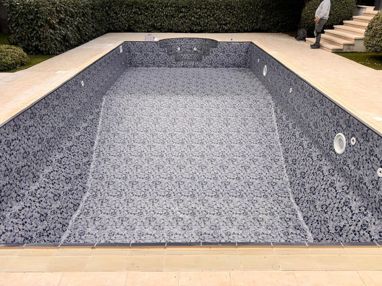 New pool liner installed in renovated swimming pool