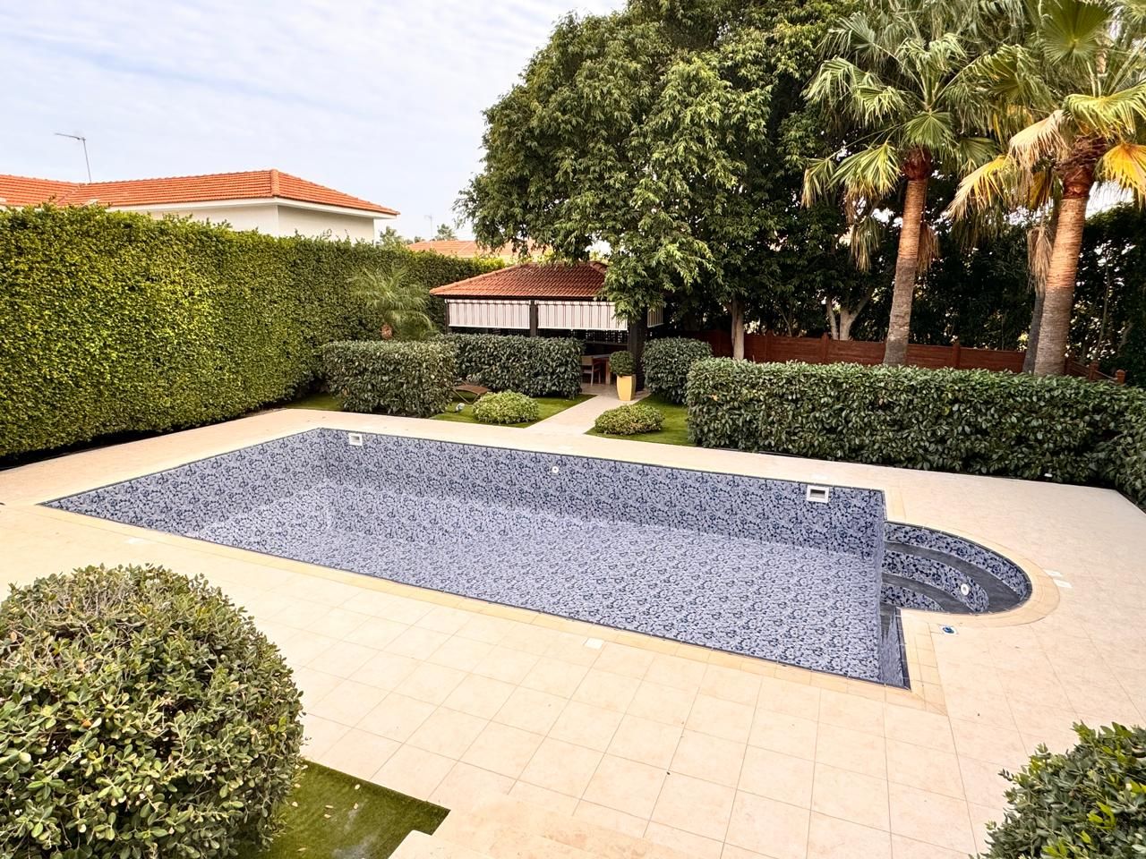 Wide view of the pool and garden with the new liner fitted, before filling